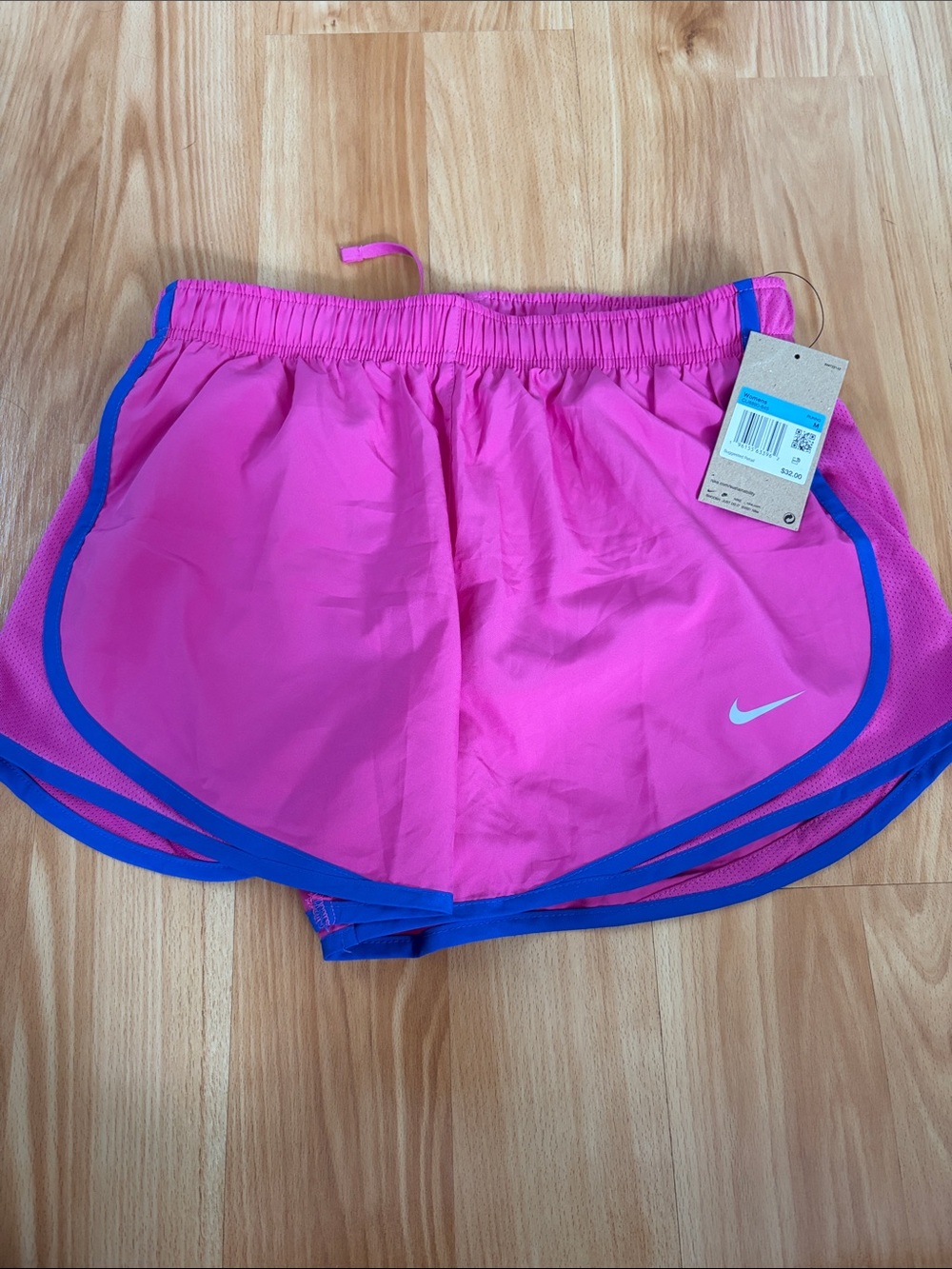 Nike Women’s Pink Athletic Shorts with Blue Trim